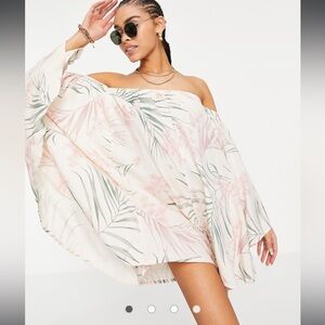 ASOS DESIGN batwing beach playsuit featuring a pink and green palm print